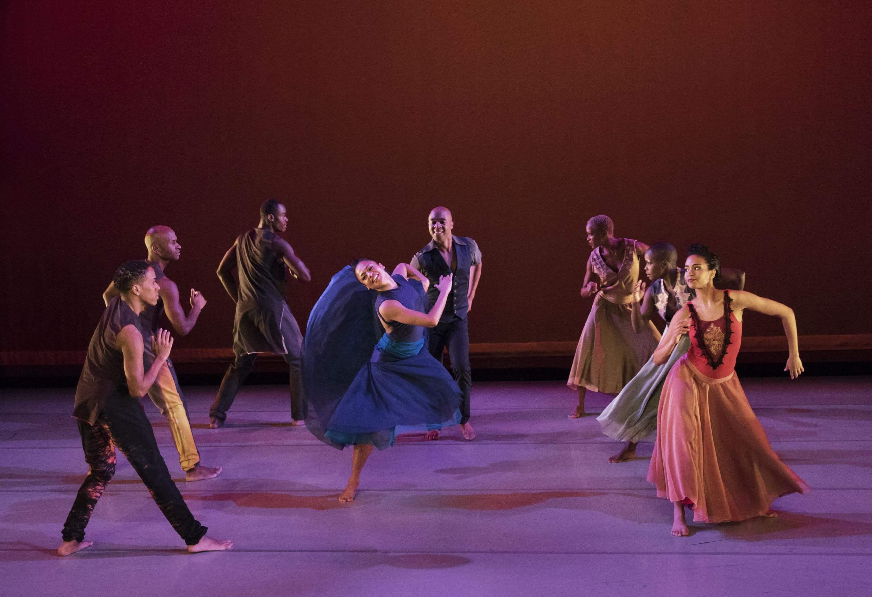 Photo of Ailey dancers with one cenetered in Open Door