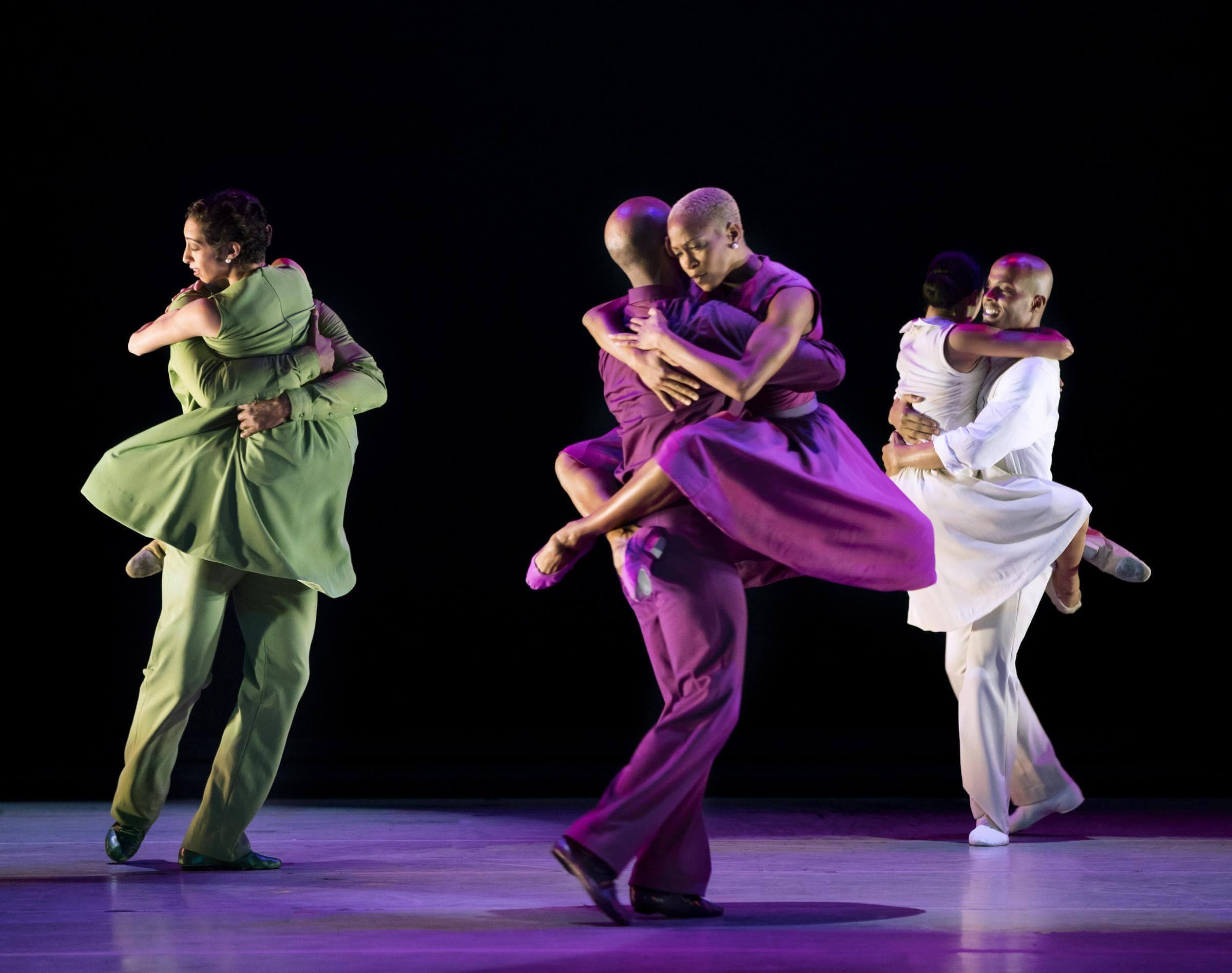 Photo of dancers in matching clothing holding each other in r-Evolution dream