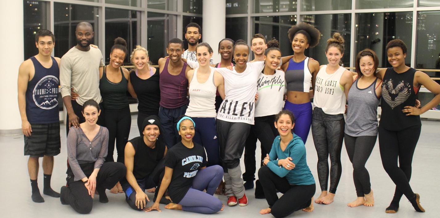 Group of Ailey School alumni wearing AILEY merch and posing together