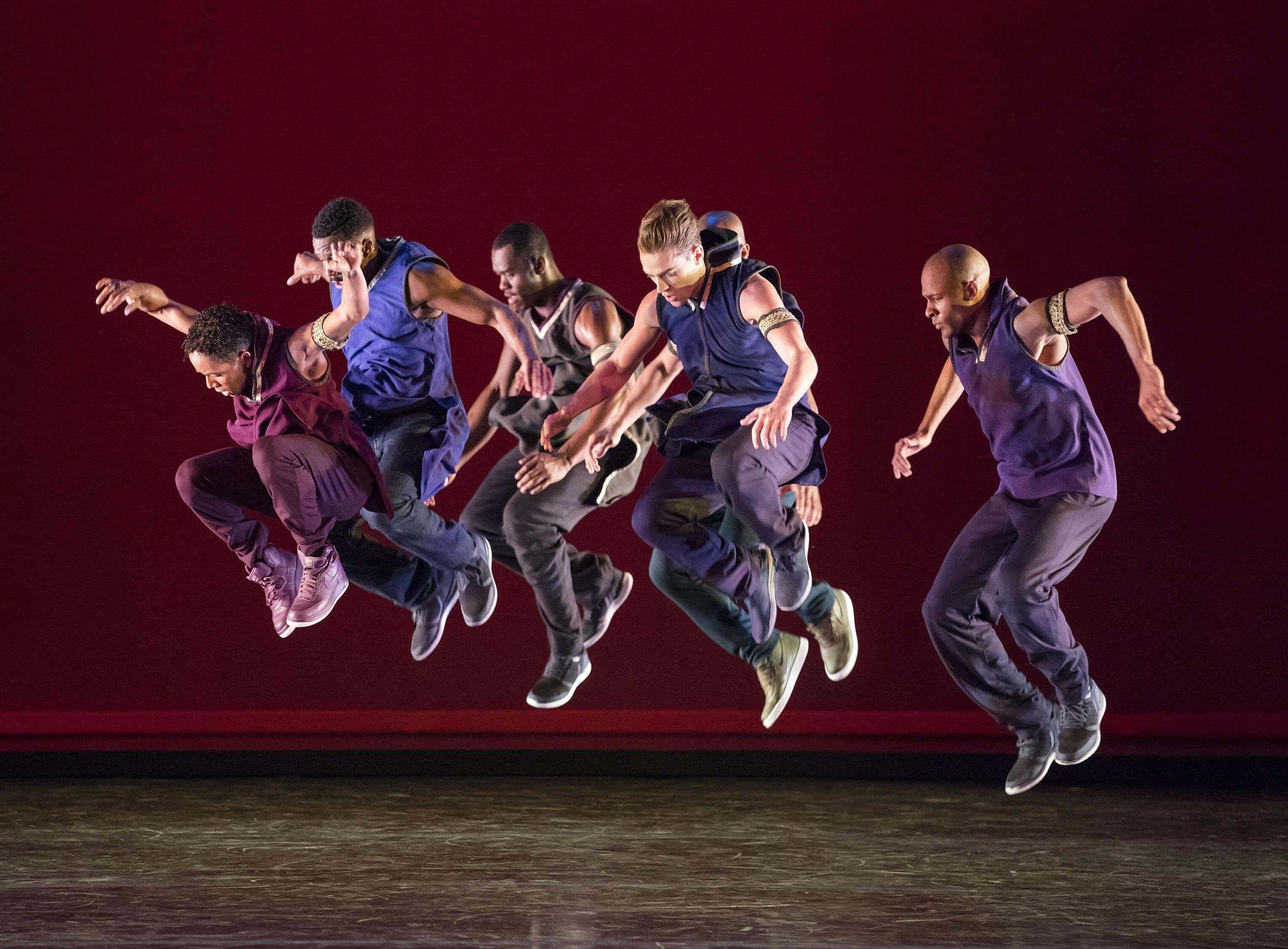 All of the dancers leaping into the air at the same time